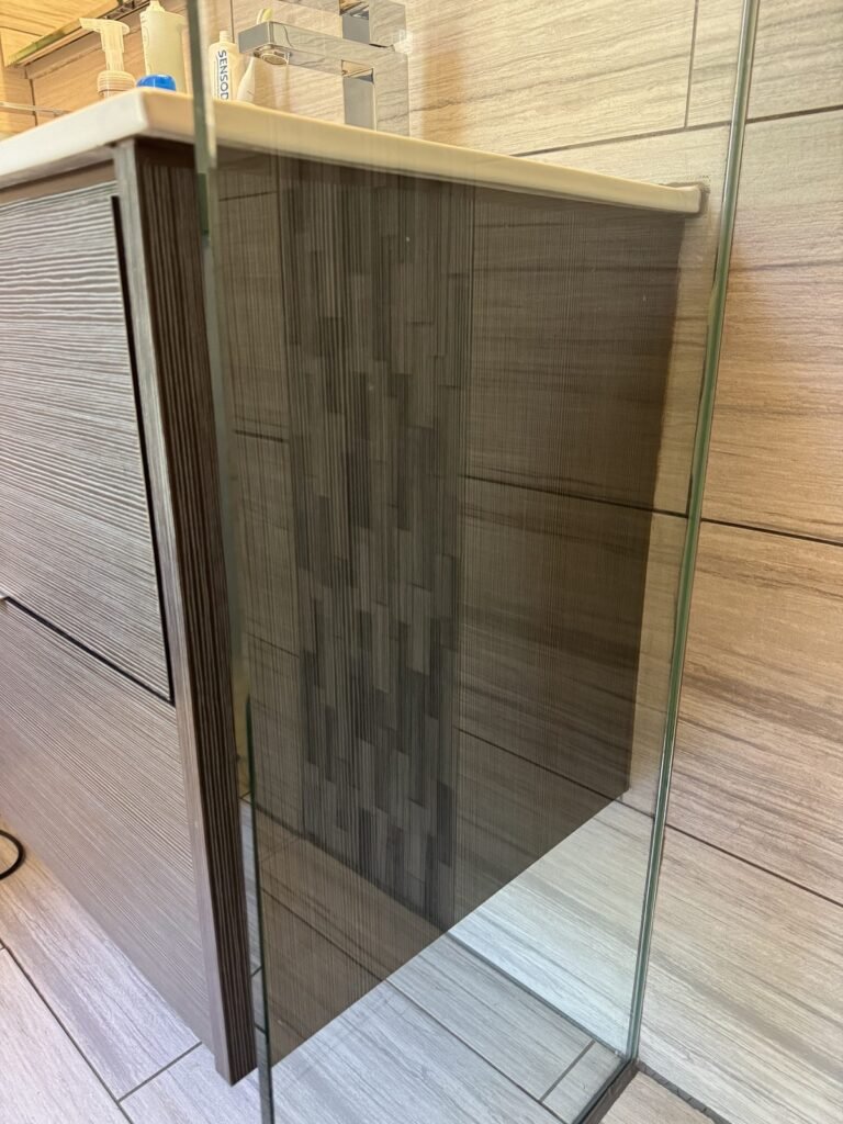 Clear, streak-free glass shower partition after JenyClean deep cleaning in Issaquah, WA