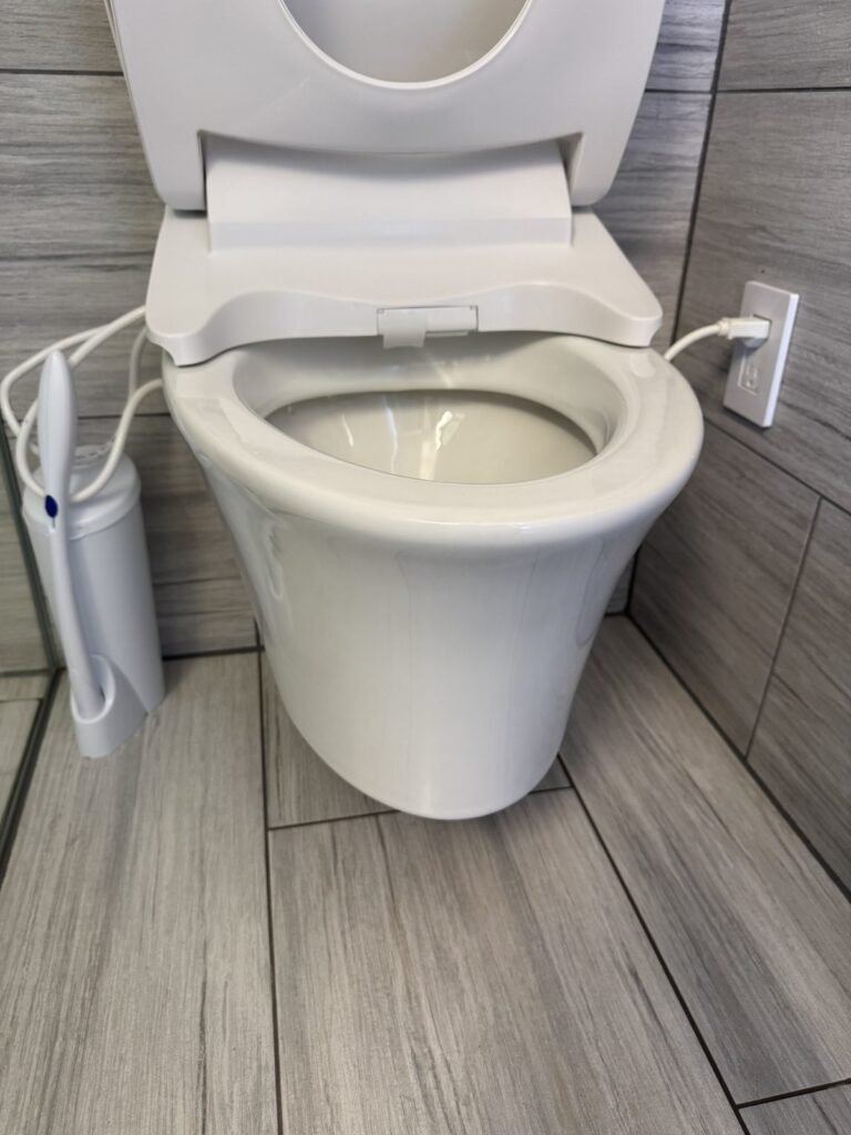 Clean white toilet bowl and bidet seat after JenyClean two-bathroom deep cleaning in Issaquah, WA