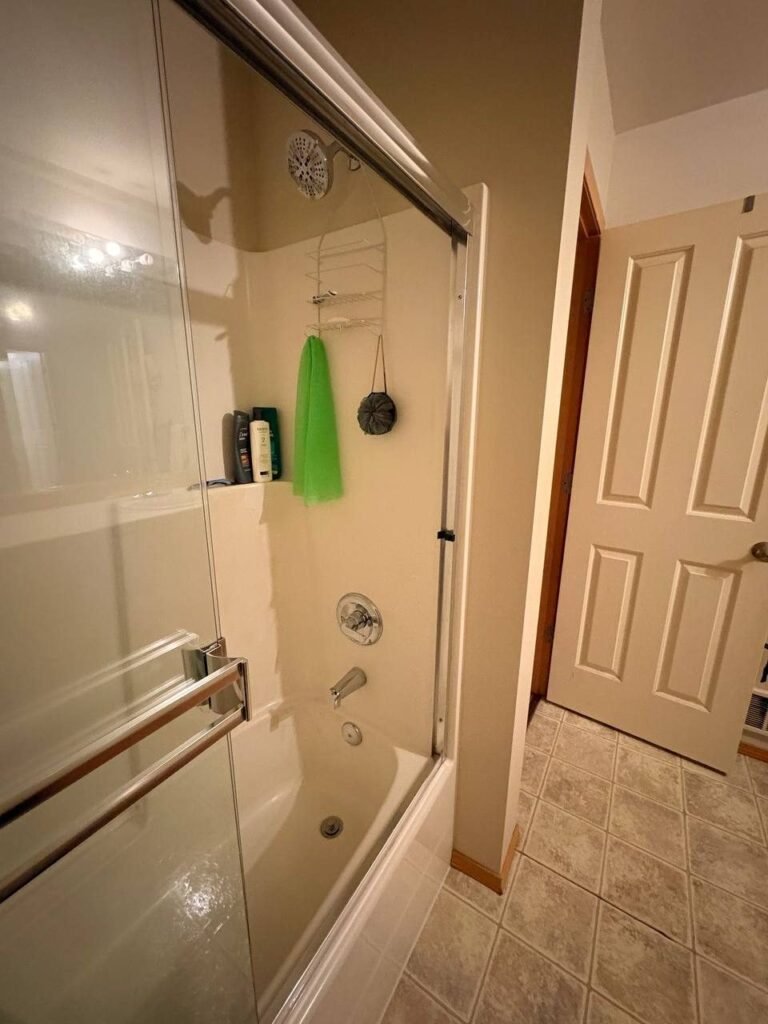 Clean white bathtub and shower surround after JenyClean standard cleaning in Issaquah, WA