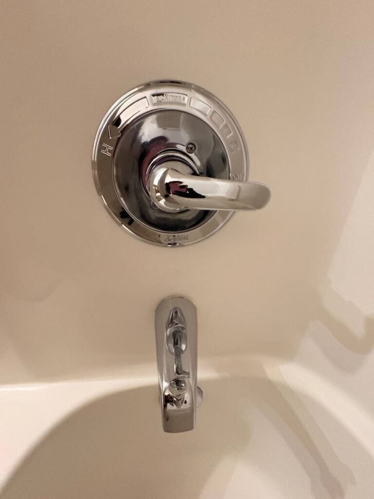 Shiny chrome tub faucet and valve trim after limescale removal by JenyClean in Issaquah, WA