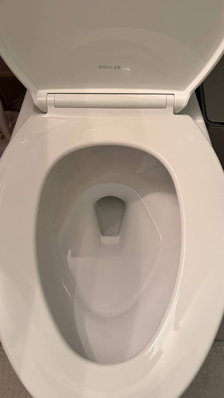 Clean white toilet bowl and seat after JenyClean deep cleaning in Kirkland, WA