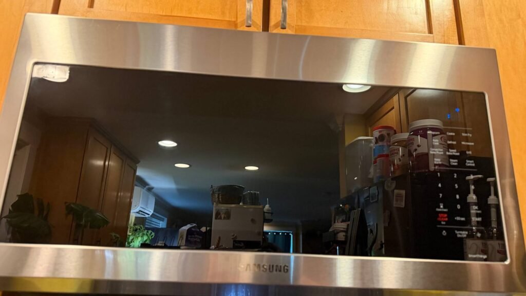 Over-the-range microwave with a clean glass door and stainless frame after JenyClean kitchen deep cleaning in Kirkland, WA