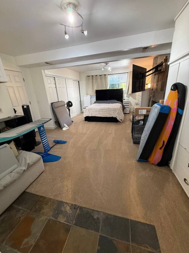 Same bedroom with a made bed, cleared and vacuumed carpet after JenyClean monthly cleaning in Redmond, WA