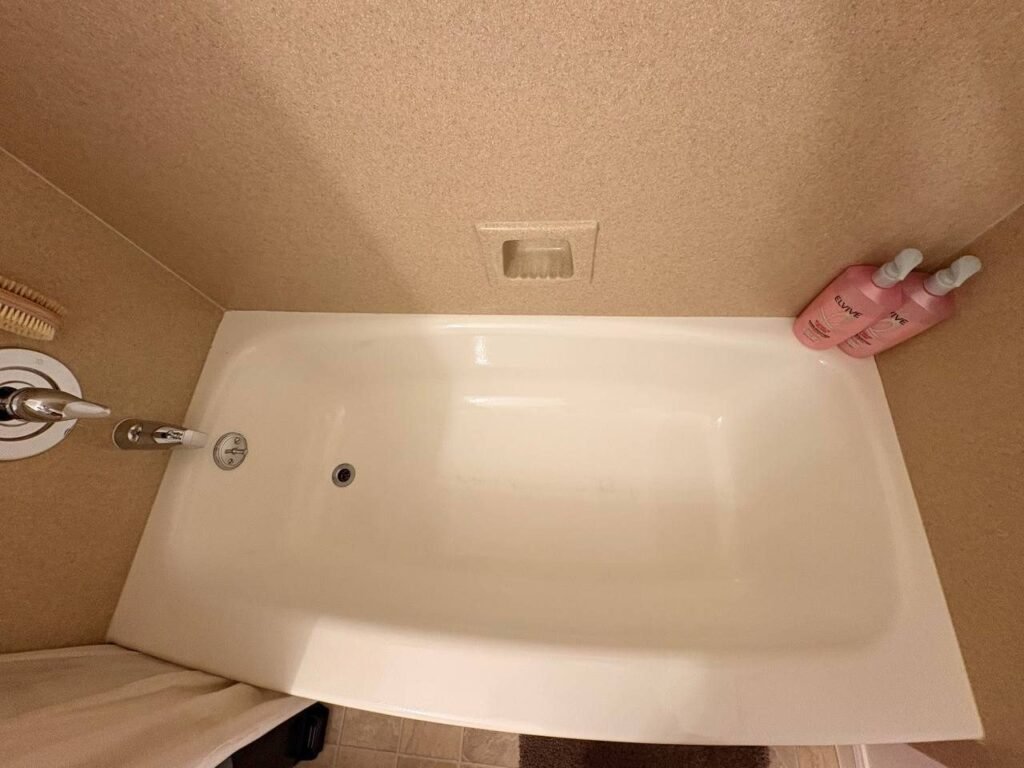Same bathtub with a clean white finish after JenyClean deep cleaning in Seattle, WA
