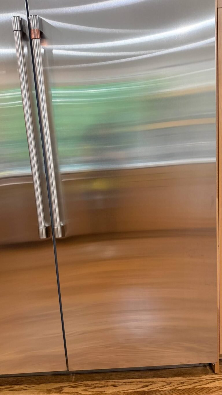 Lower stainless fridge door with an even finish and no fingerprints after JenyClean regular cleaning in Seattle, WA