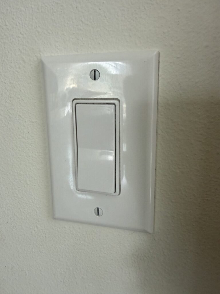 Clean white light switch plate after JenyClean urgent deep cleaning in Seattle, WA