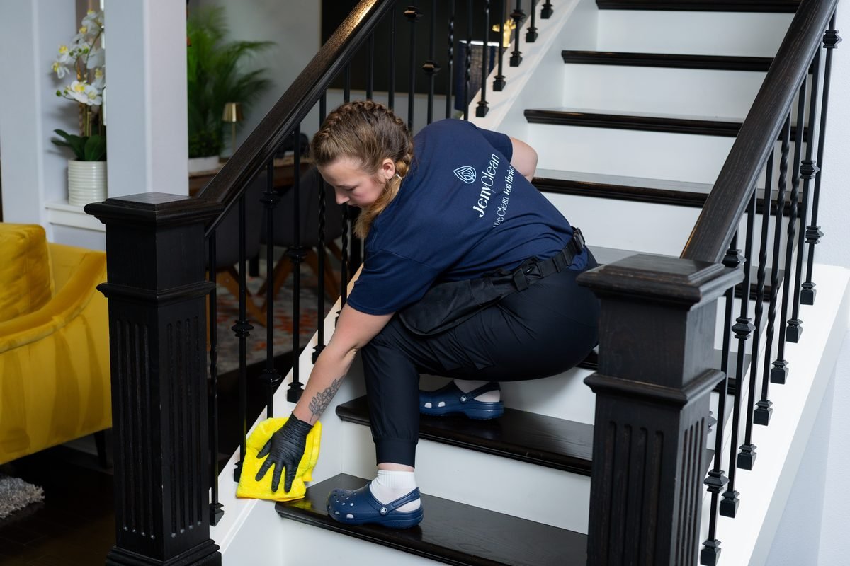 House cleaning in Redmond: JenyClean cleaner wiping staircase steps